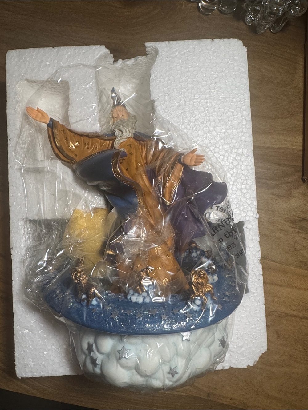 vintage Merlin wizard figurine with a zodiac-themed circular musical base